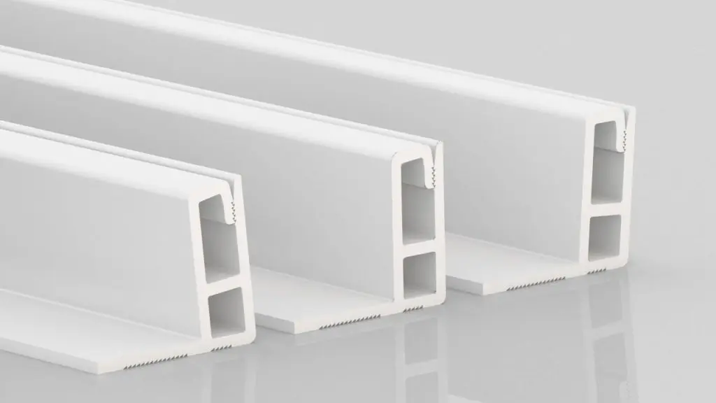 Three white, rectangular plastic or metal profiles with hollow sections are shown standing upright on a reflective surface, positioned side by side and slightly overlapping.