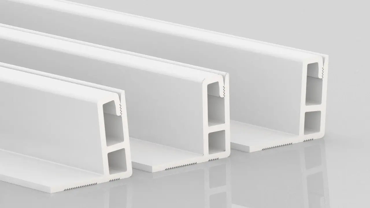 Three white, rectangular plastic or metal profiles with hollow sections are shown standing upright on a reflective surface, positioned side by side and slightly overlapping.