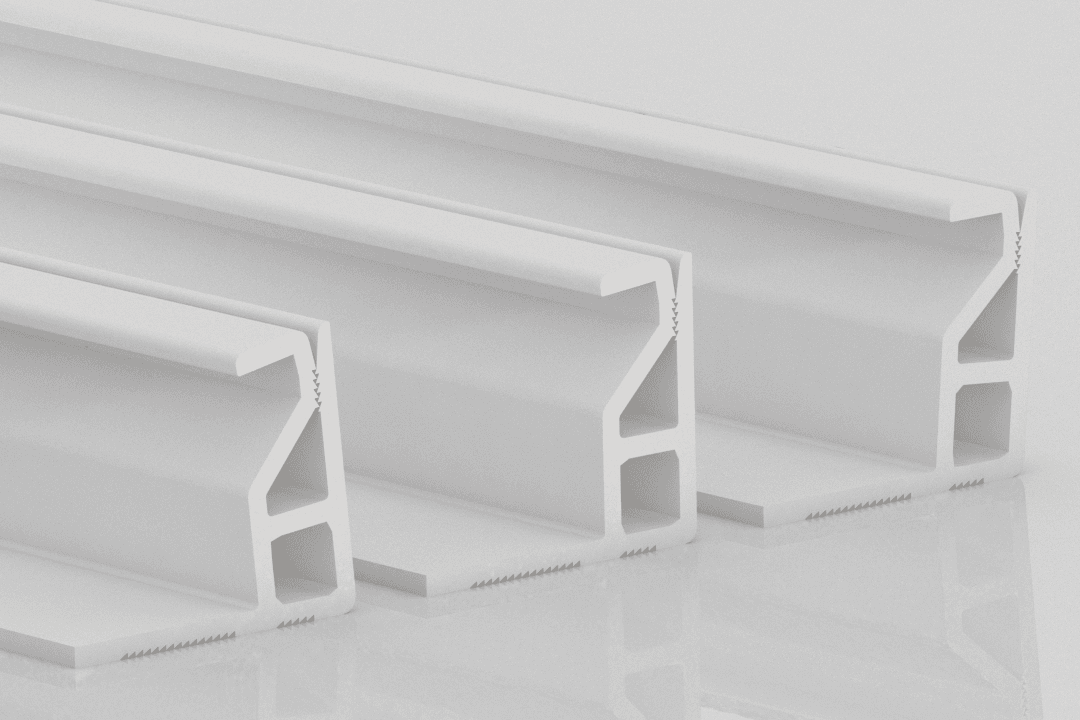 Three white aluminum extrusion profiles are arranged side by side on a reflective surface, each featuring a complex geometric cross-section. For details on how to receive similar products, explore the Fabrix™ Shipping & Delivery Information.