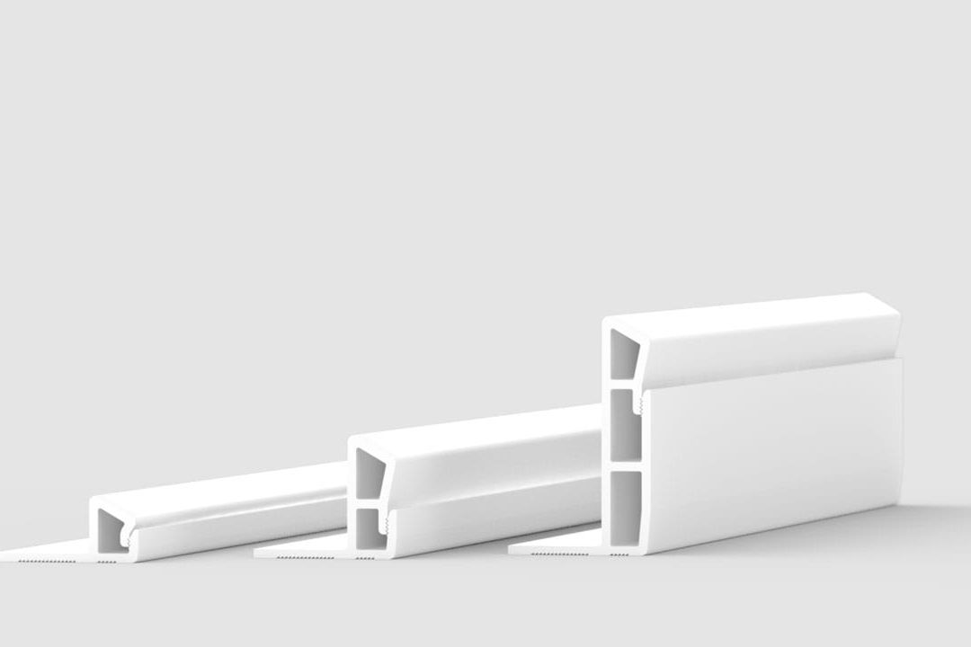 Three white rectangular plastic or rubber sealing strips, each with hollow sections and angled edges, are displayed side by side on a plain light gray background.